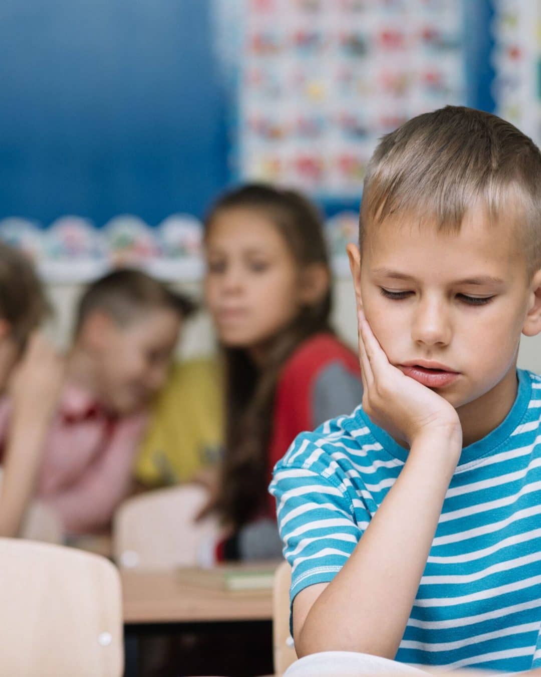 little-boy-reading-textbook-classroom-scaled.jpg